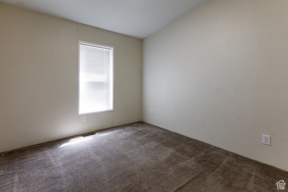 Spare room featuring carpet floors