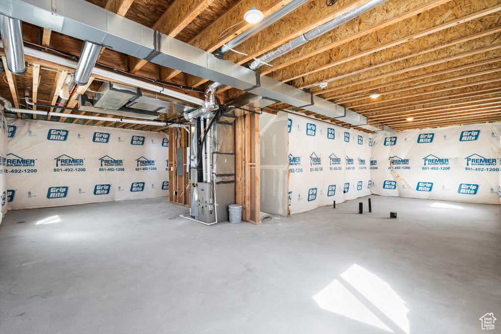 Unfinished below grade area with heating unit