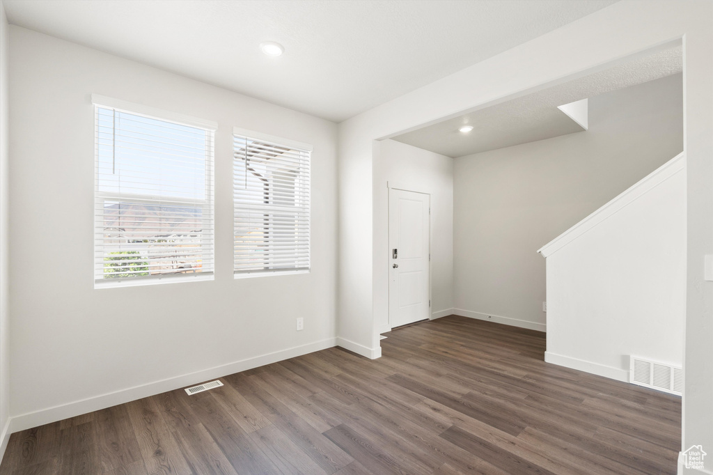 Entrance foyer featuring wood finished floors and recessed lighting