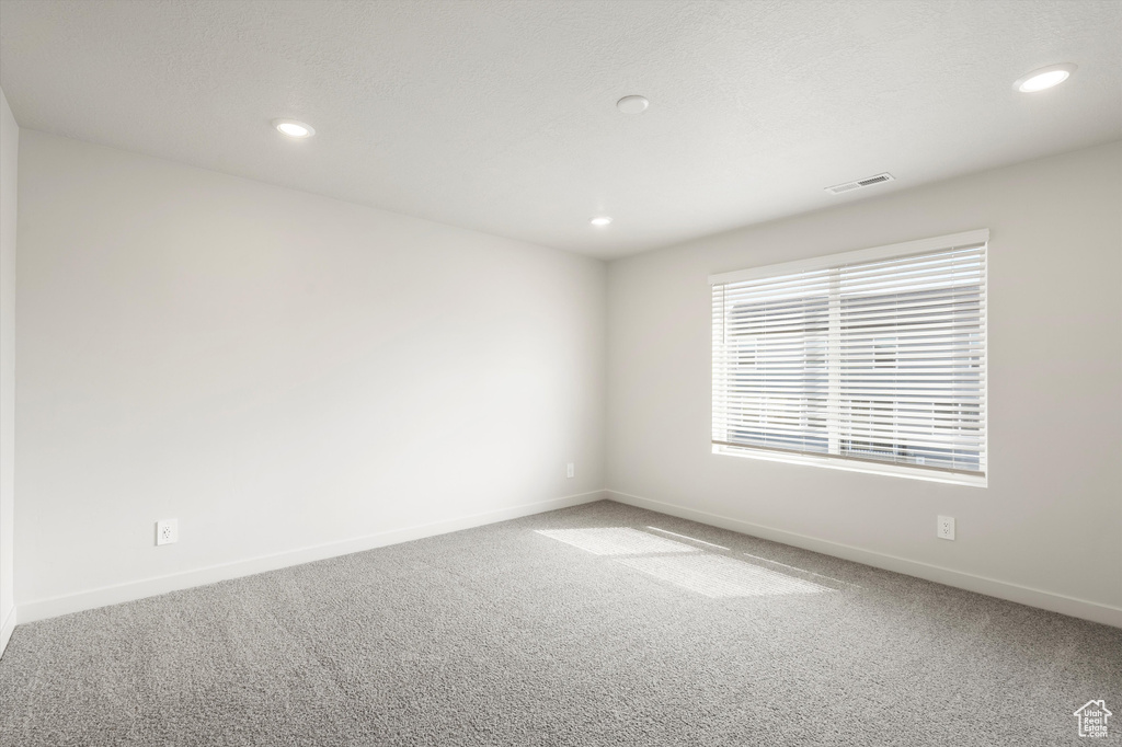 Unfurnished room with carpet and recessed lighting