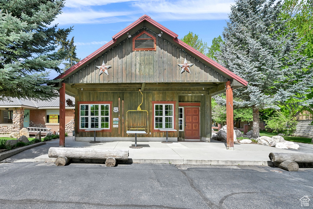 View of front of property with board and batten siding
