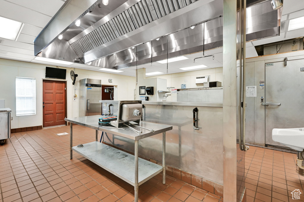 Kitchen featuring tile patterned flooring and baseboards