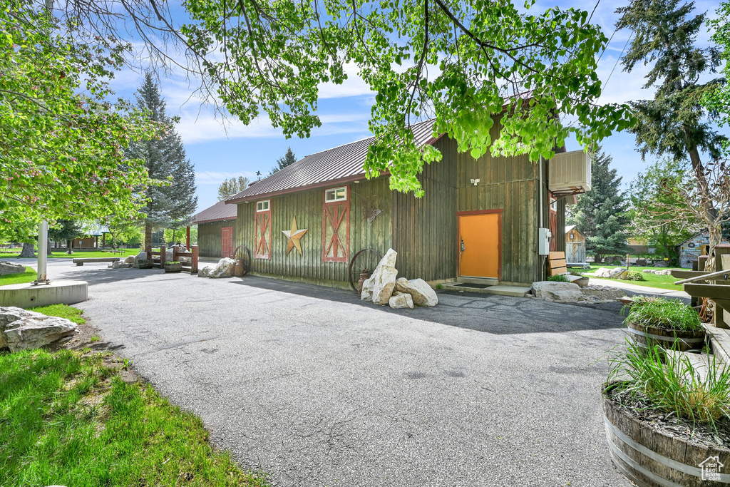 View of side of home featuring metal roof