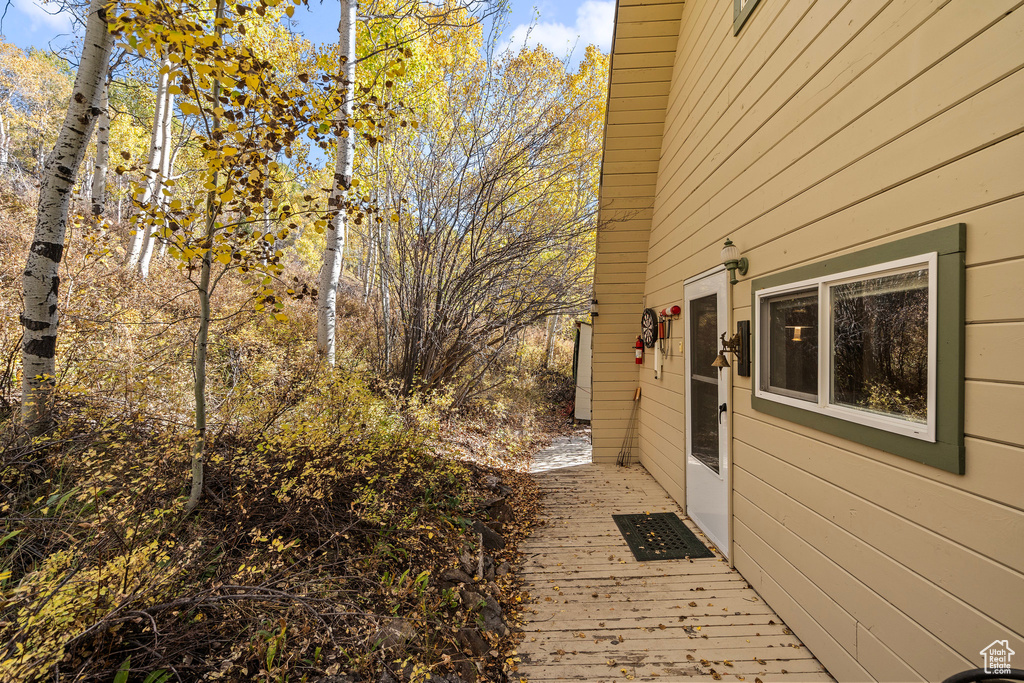View of property exterior featuring a deck