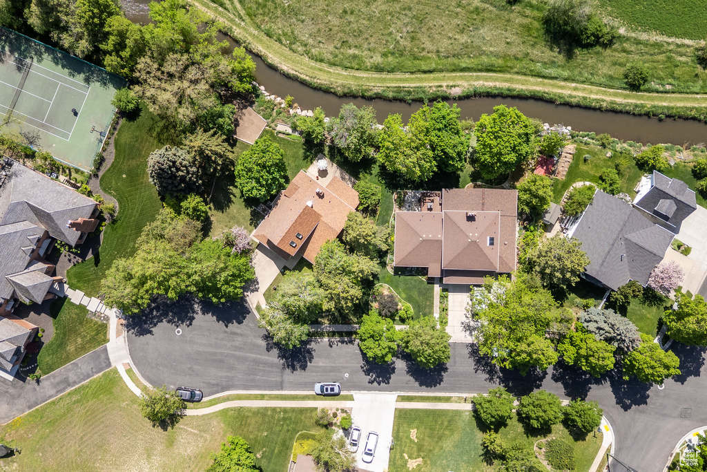 Aerial overview of property\'s location featuring a nearby body of water and nearby suburban area
