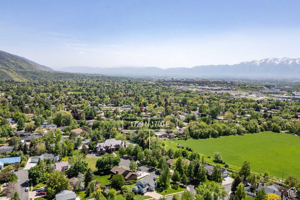 Aerial view of residential area with a mountainous background