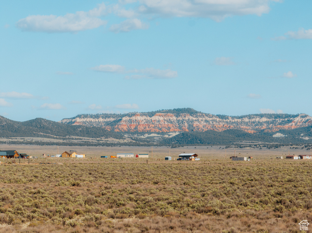 View of mountain backdrop featuring rural landscape