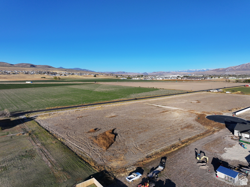 Overview of rural landscape featuring a mountainous background