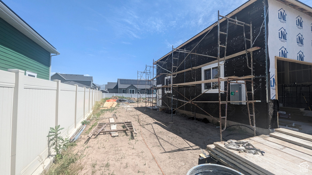 View of fenced backyard