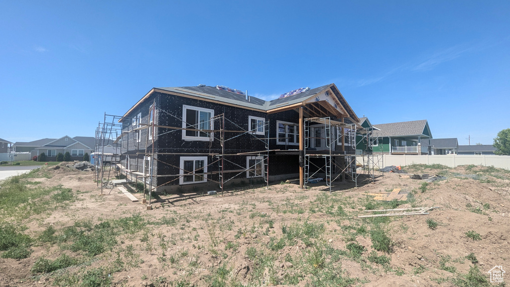 Back of house with a deck