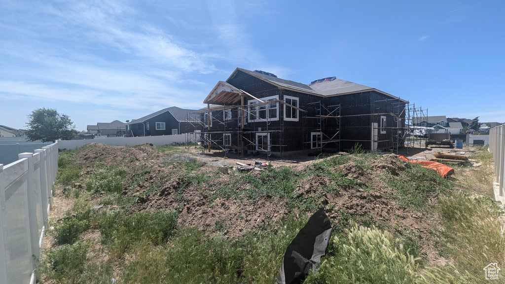 Rear view of house with fence