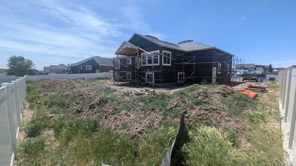 View of side of property with fence