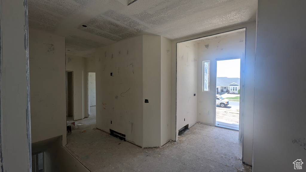Empty room with a textured ceiling