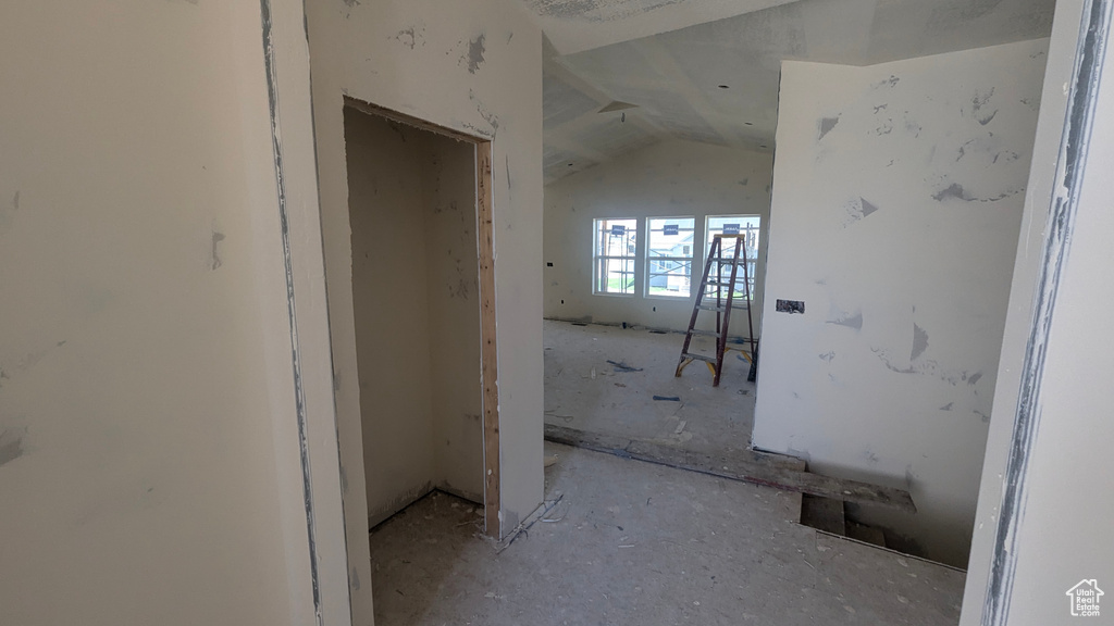 Hallway featuring lofted ceiling