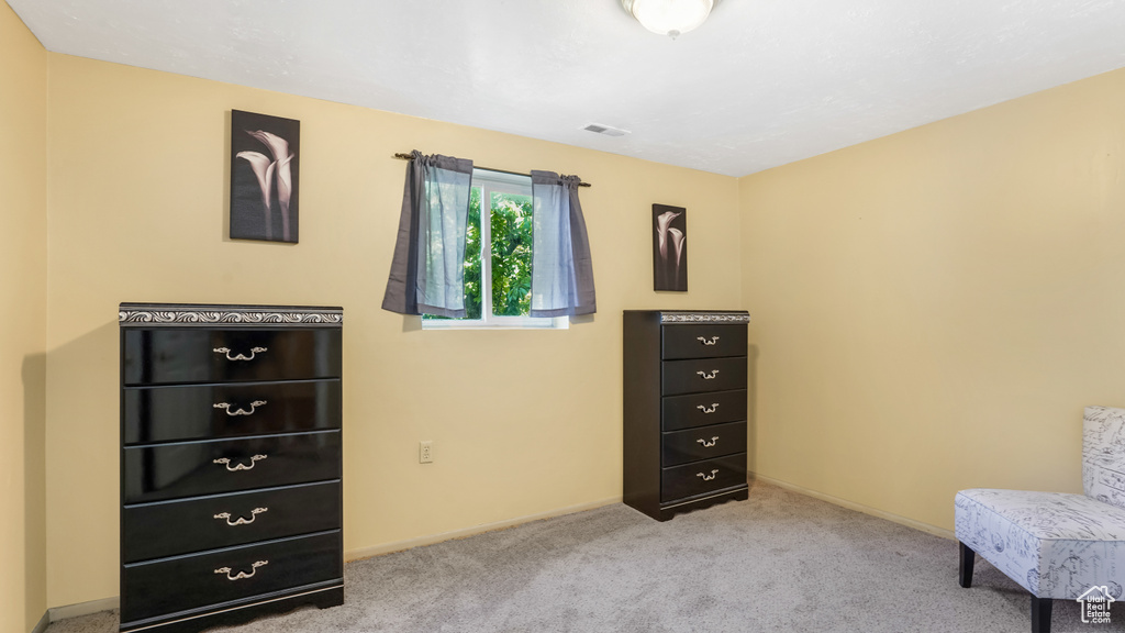 Living area with carpet and baseboards