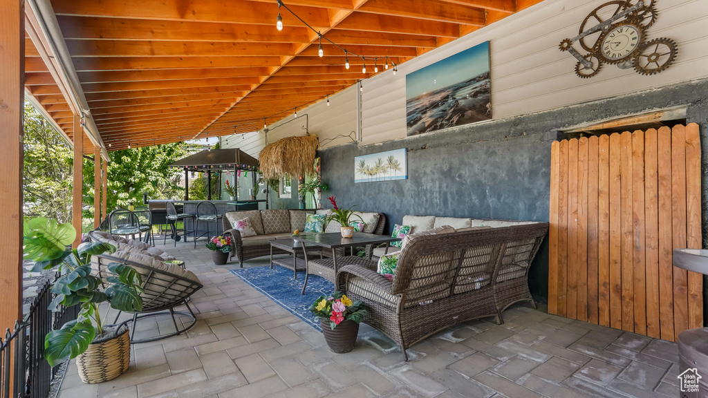 View of patio with an outdoor hangout area