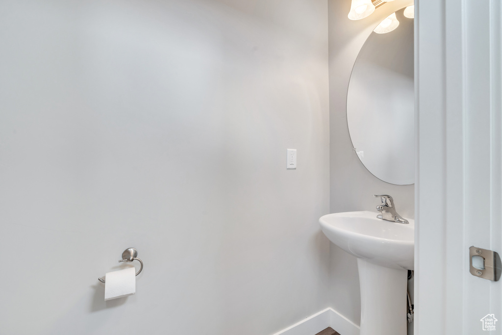 Bathroom with baseboards and a sink