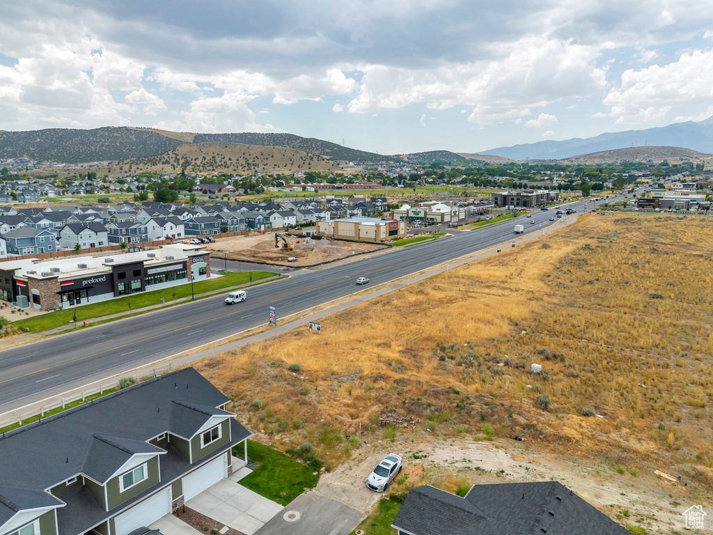 Aerial perspective of suburban area featuring a mountain backdrop
