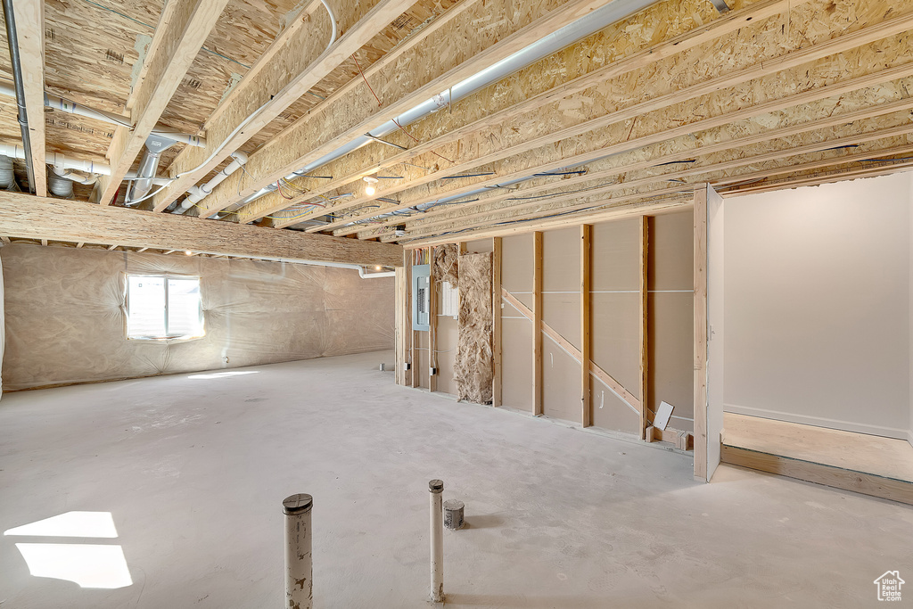 Basement featuring electric panel