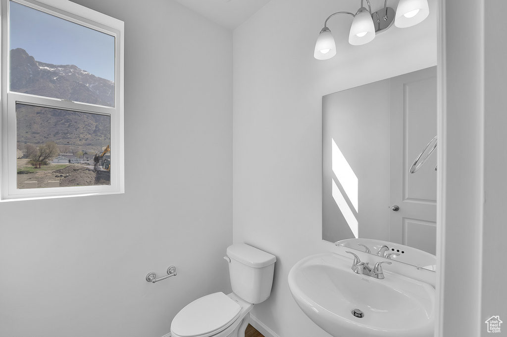 Half bath featuring a sink and toilet
