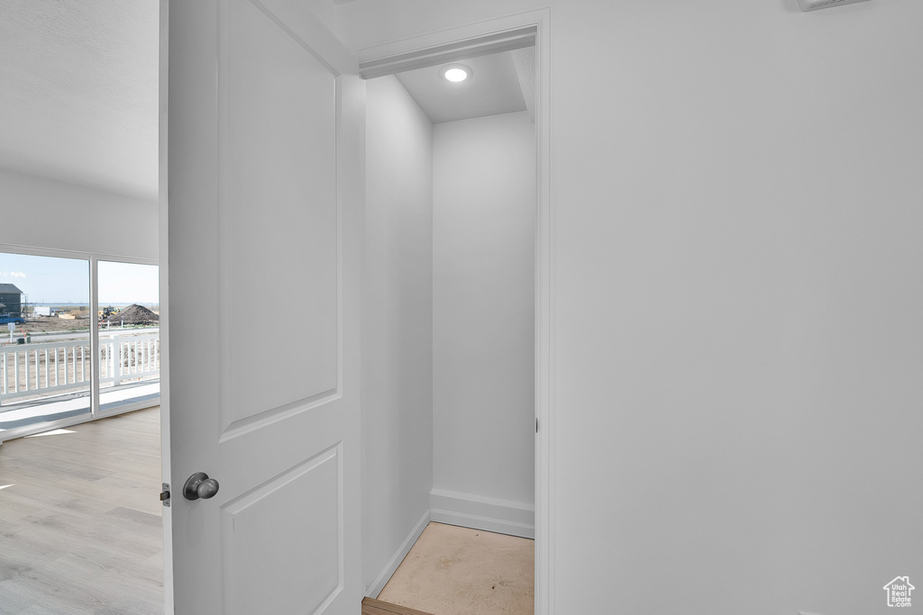 Detailed view of baseboards and recessed lighting