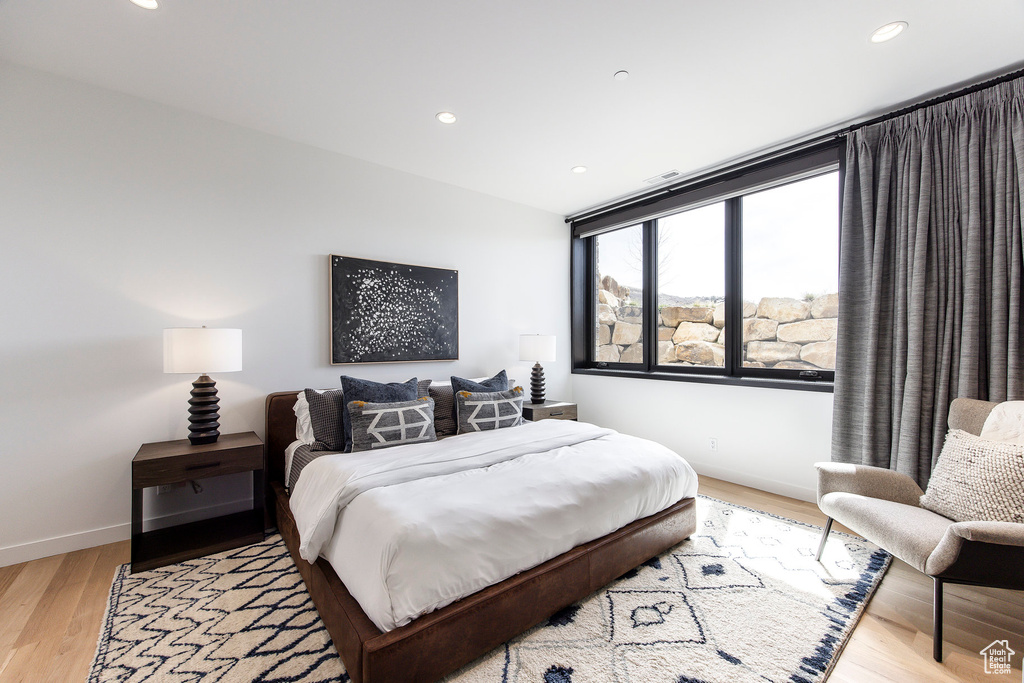 Bedroom featuring light wood-style flooring, recessed lighting, and baseboards