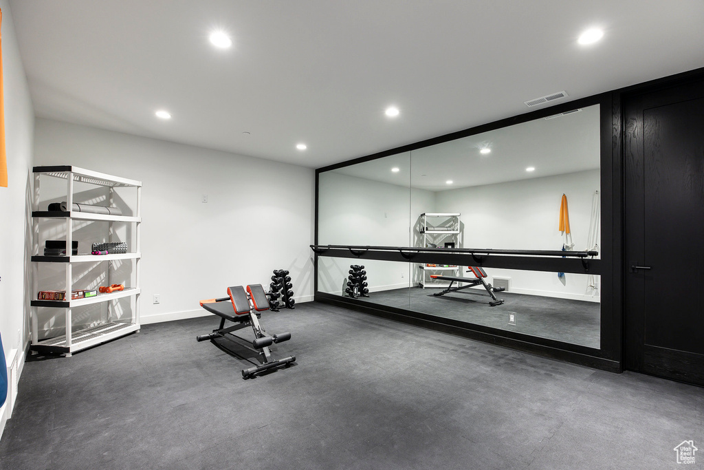 Workout room with recessed lighting and baseboards