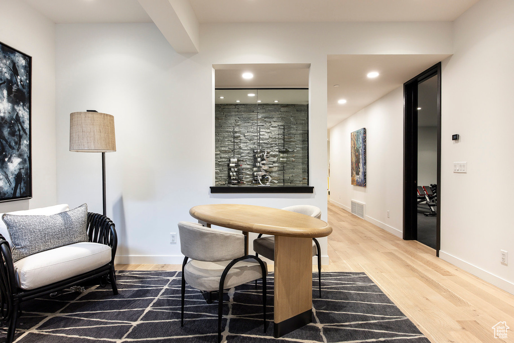 Bar area with wood finished floors, recessed lighting, and baseboards