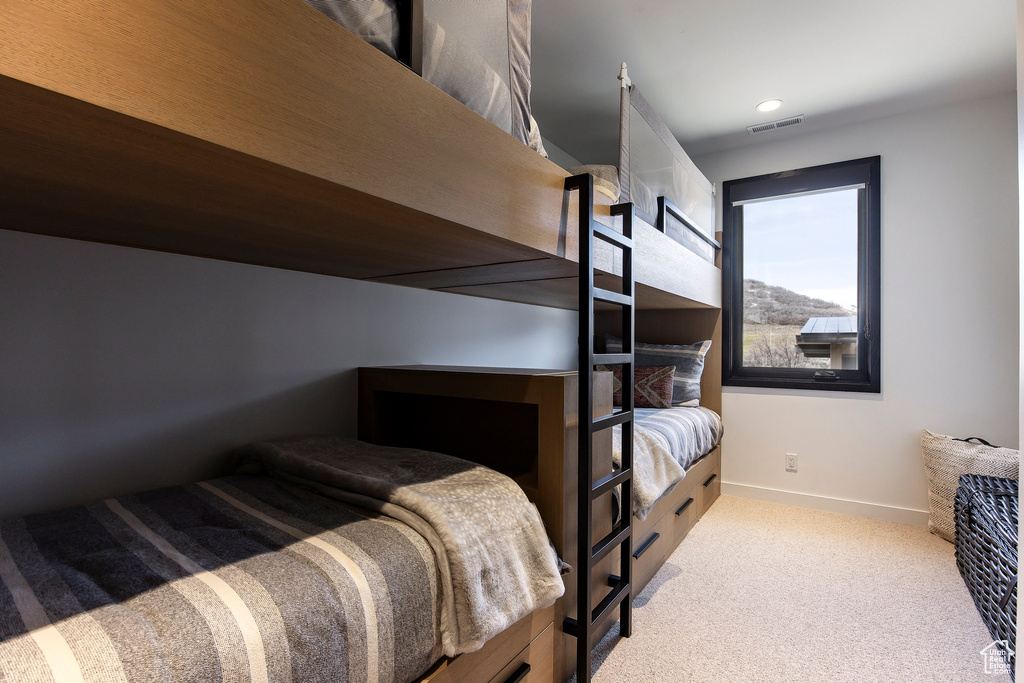 Bedroom with carpet, baseboards, and recessed lighting