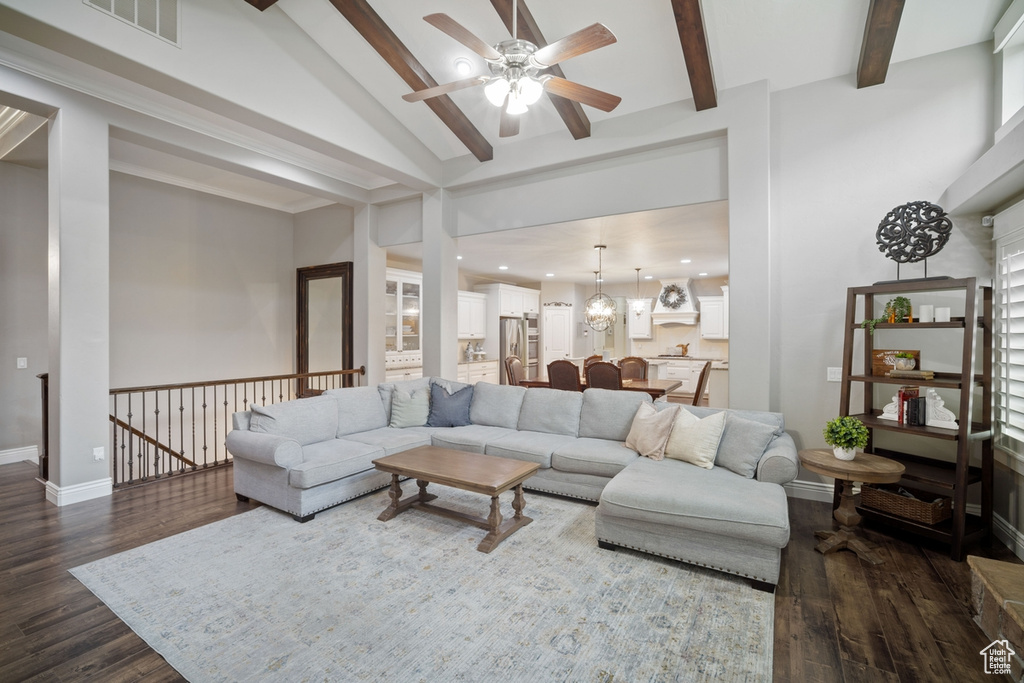 Living room featuring ceiling fan, dark wood-style flooring, a chandelier, recessed lighting, and baseboards