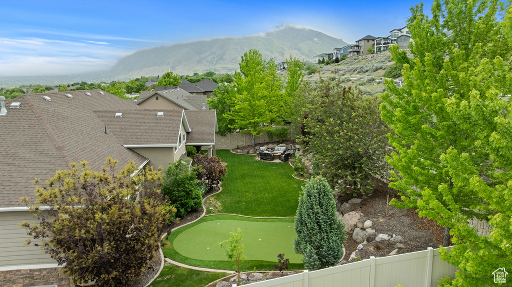 Aerial perspective of suburban area with a mountain backdrop