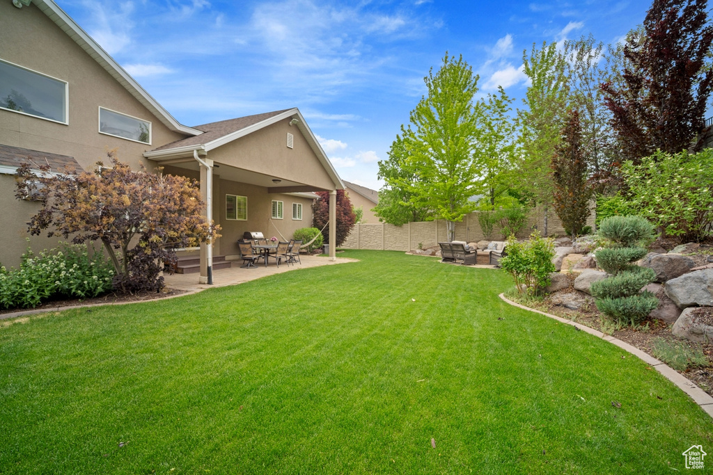 View of yard featuring an outdoor living space and a patio area