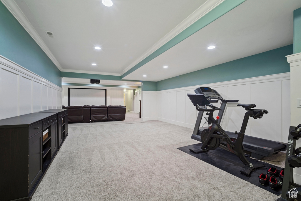 Workout area with carpet, ornamental molding, a decorative wall, a wainscoted wall, and recessed lighting