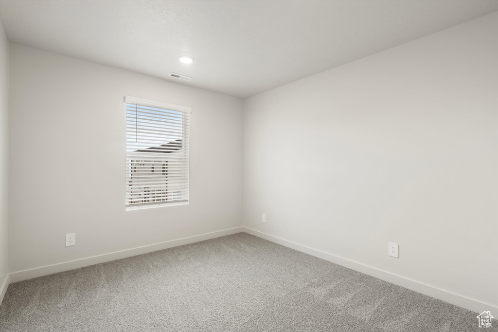 Unfurnished room featuring carpet floors and recessed lighting