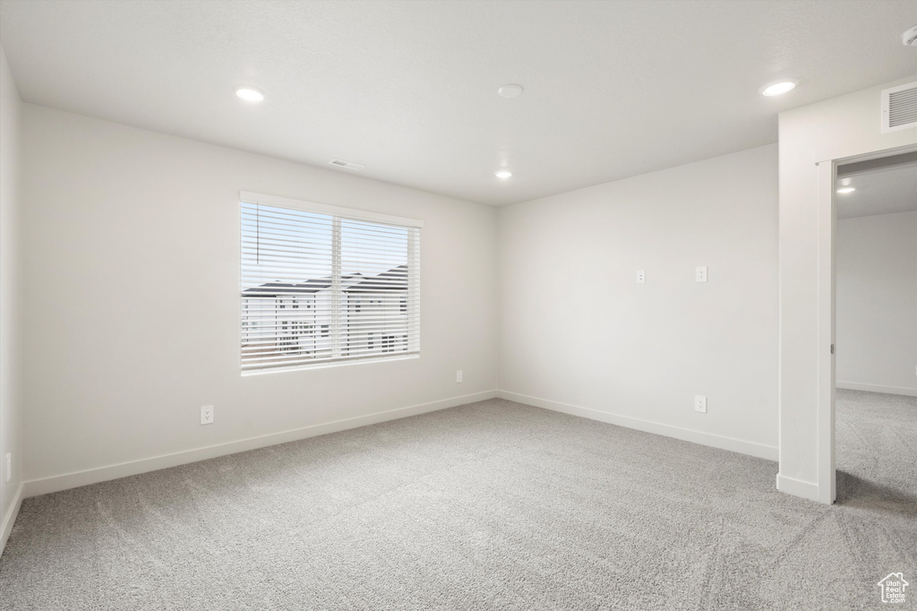 Unfurnished bedroom featuring carpet floors and recessed lighting