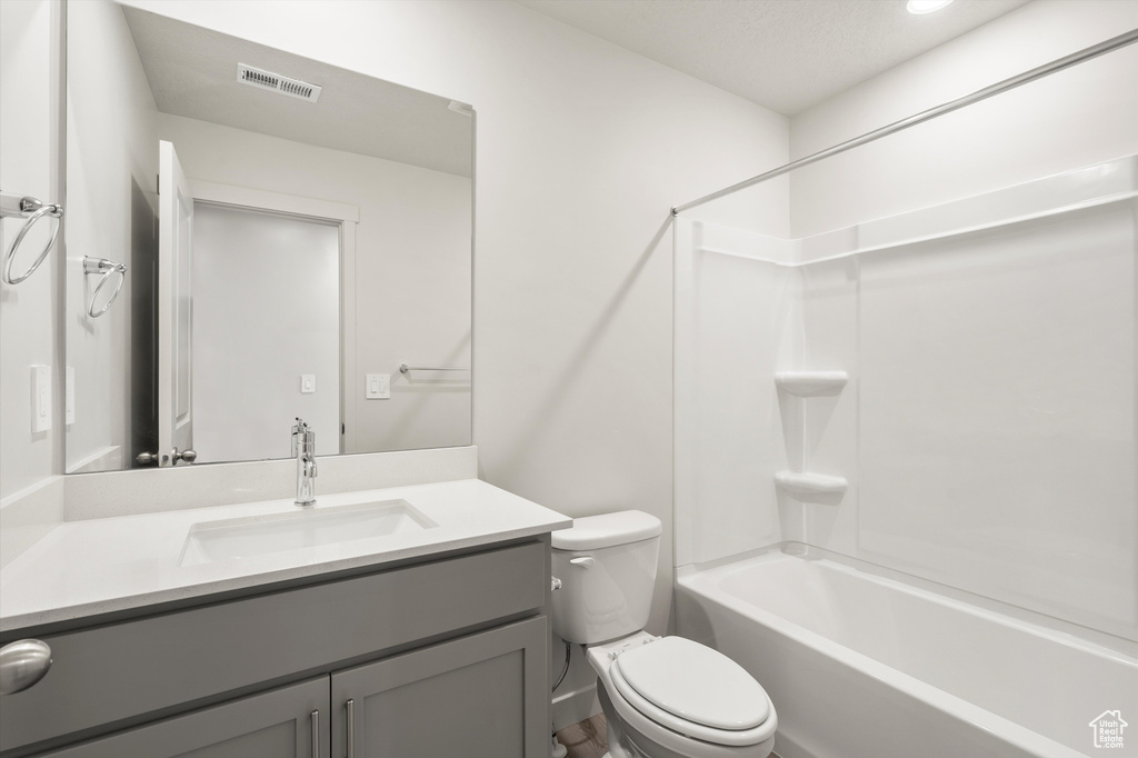 Full bath featuring vanity and shower / bathtub combination