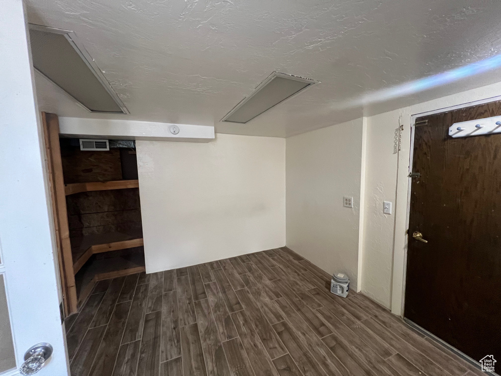 Below grade area with dark wood-style floors