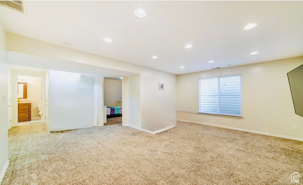 Below grade area featuring carpet, baseboards, and recessed lighting