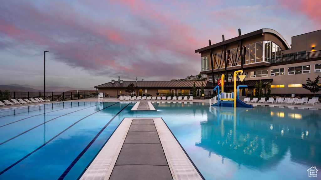 Community pool with fence and a patio