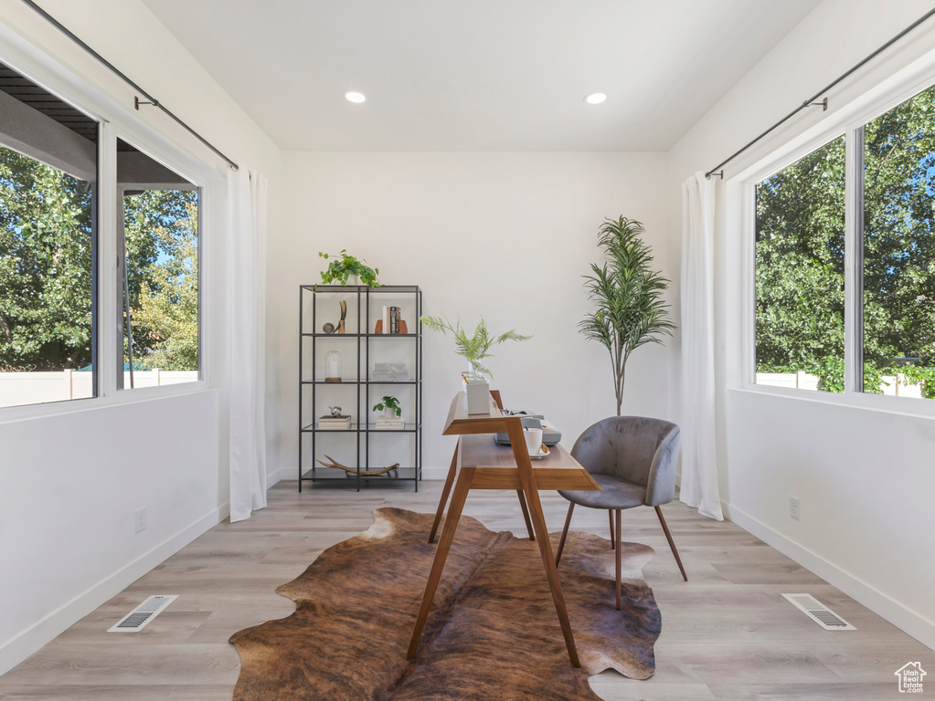 Office with baseboards, recessed lighting, and light wood-type flooring