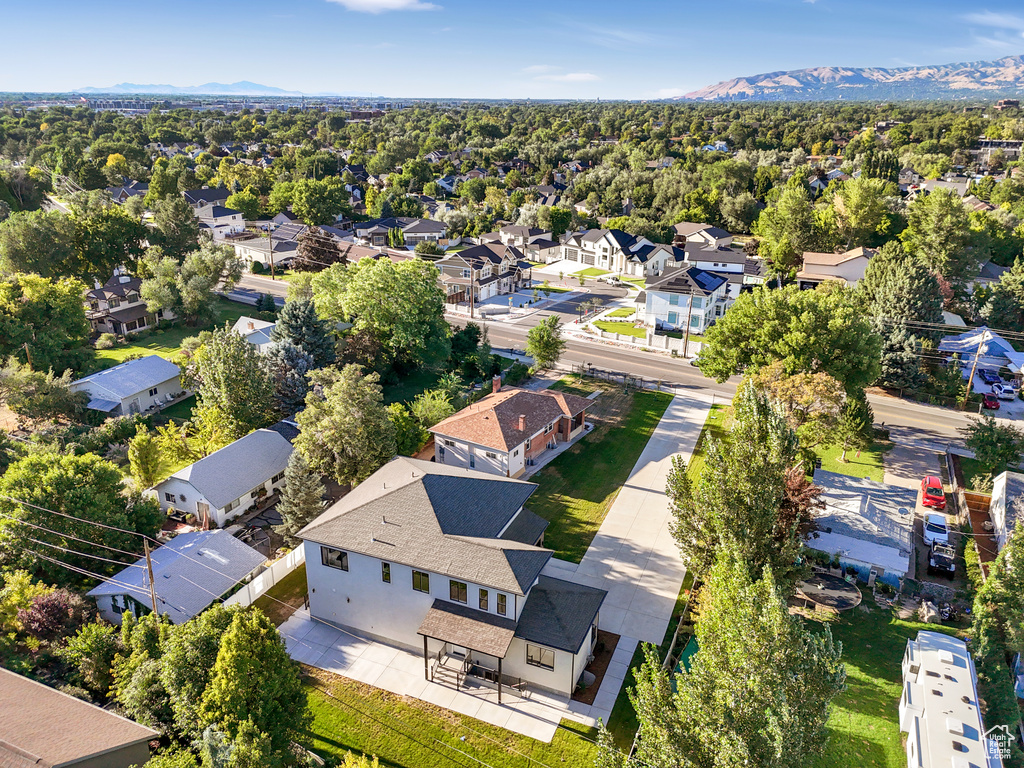 Aerial perspective of suburban area with a mountain backdrop