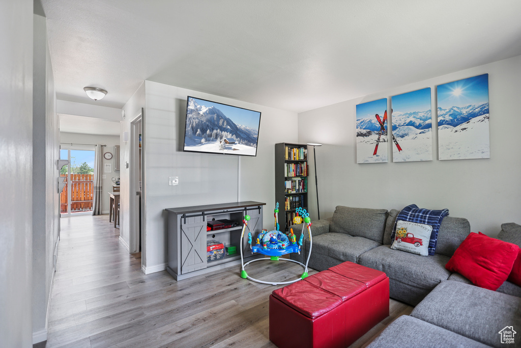 Living area featuring wood finished floors and baseboards