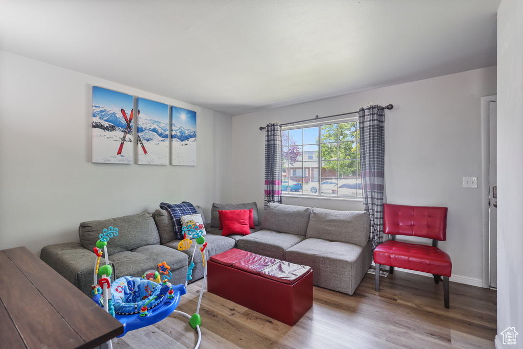 Living room with wood finished floors and baseboards