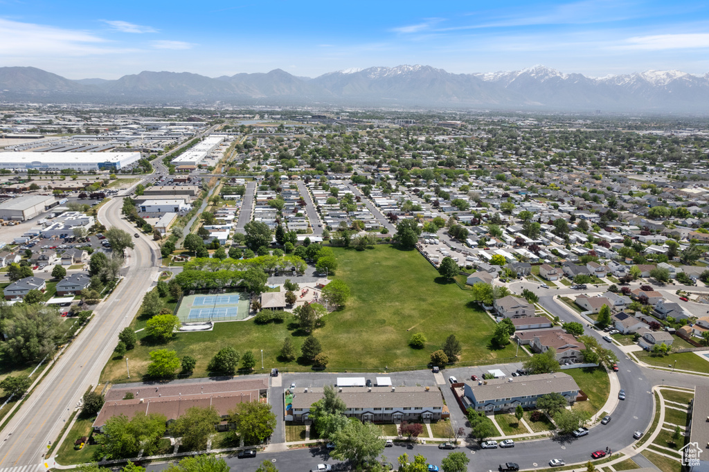 Aerial view of property\\\'s location with a mountainous background and nearby suburban area