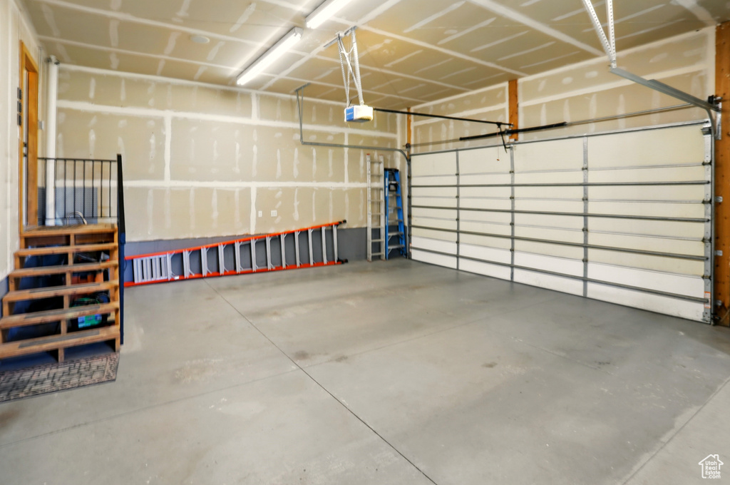 Garage featuring a garage door opener