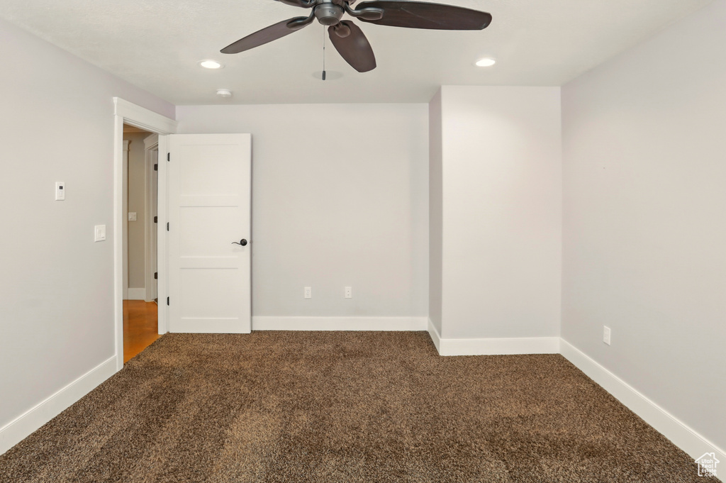 Unfurnished room with carpet floors, ceiling fan, recessed lighting, and baseboards