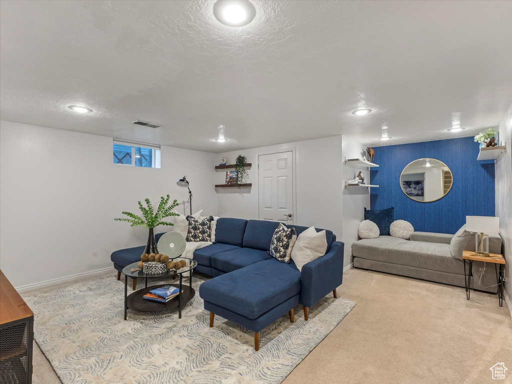 Living room featuring carpet floors, baseboards, and recessed lighting