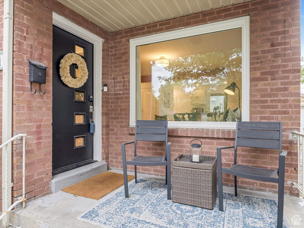 Entrance to property with brick siding