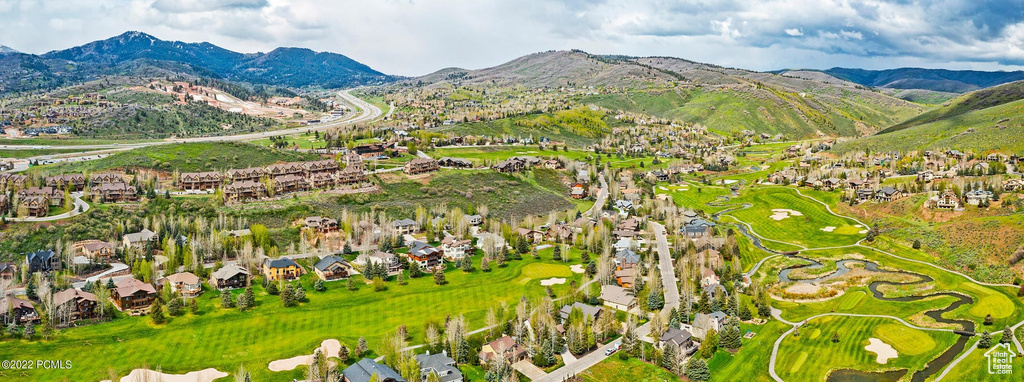 View of mountain backdrop featuring nearby suburban area and a golf club