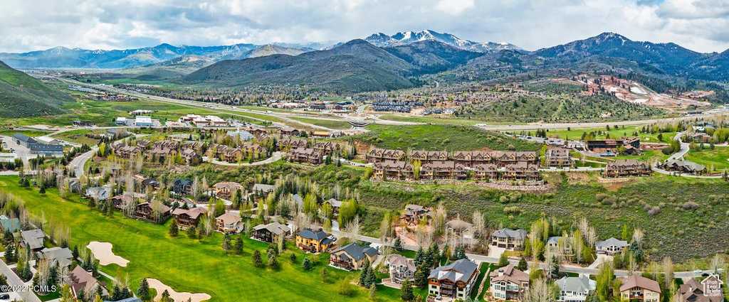 Aerial view of residential area featuring mountains